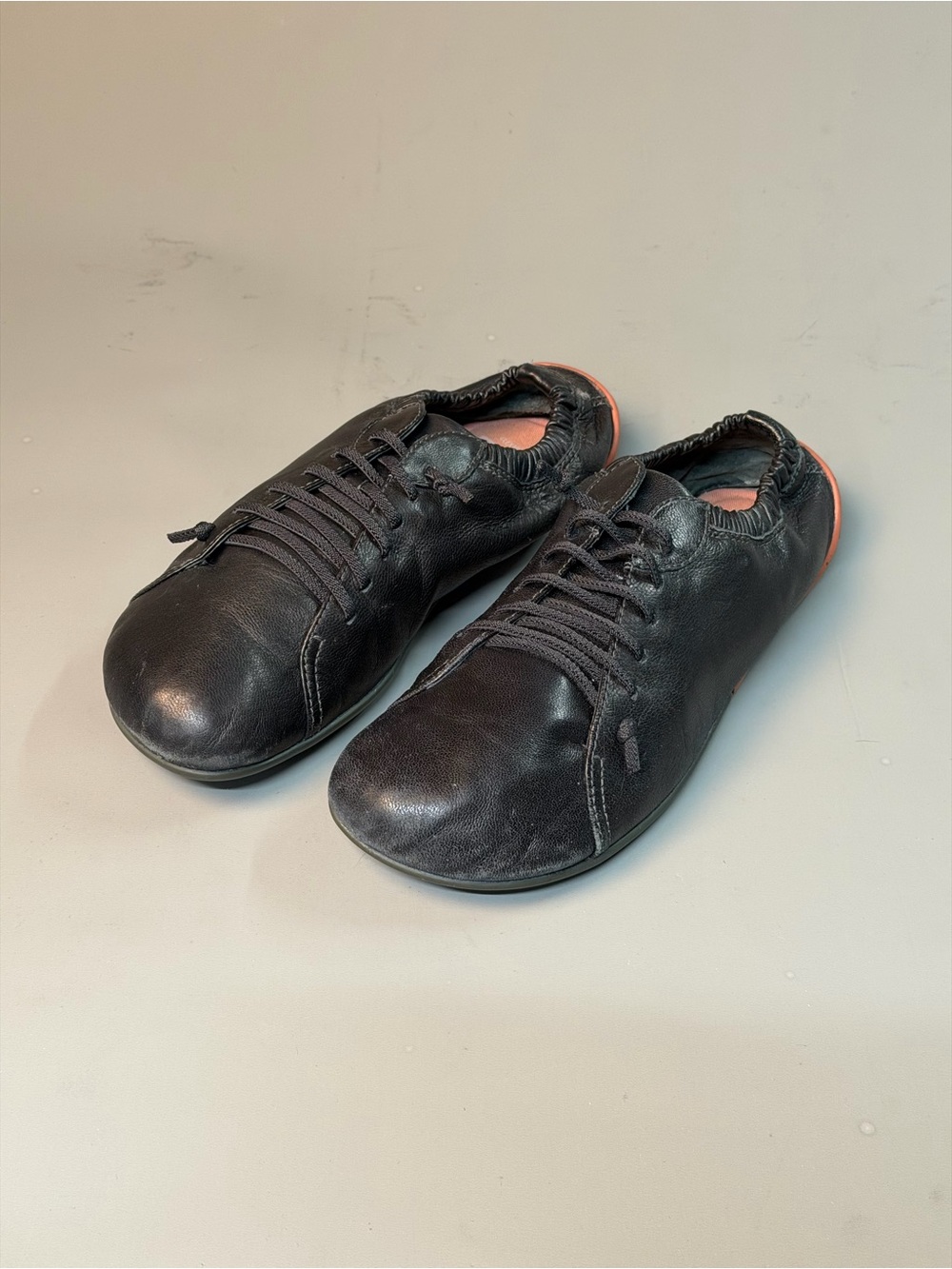 Camper Black Leather Slip-On Casual Flats with Subtle Coral Trim